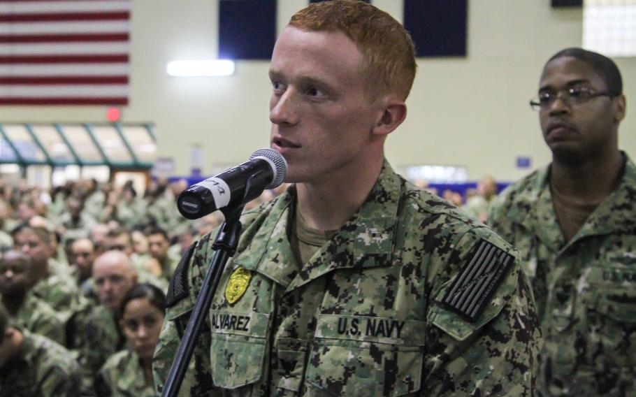 Luke Alvarez, petty officer third class, asks Chief of Naval Operations Adm. Jonathan Greenert about the future strategic direction of the Navy's role in Bahrain, at an all-hands call on Naval Support Activity Bahrain on Wednesday Nov. 27, 2013.