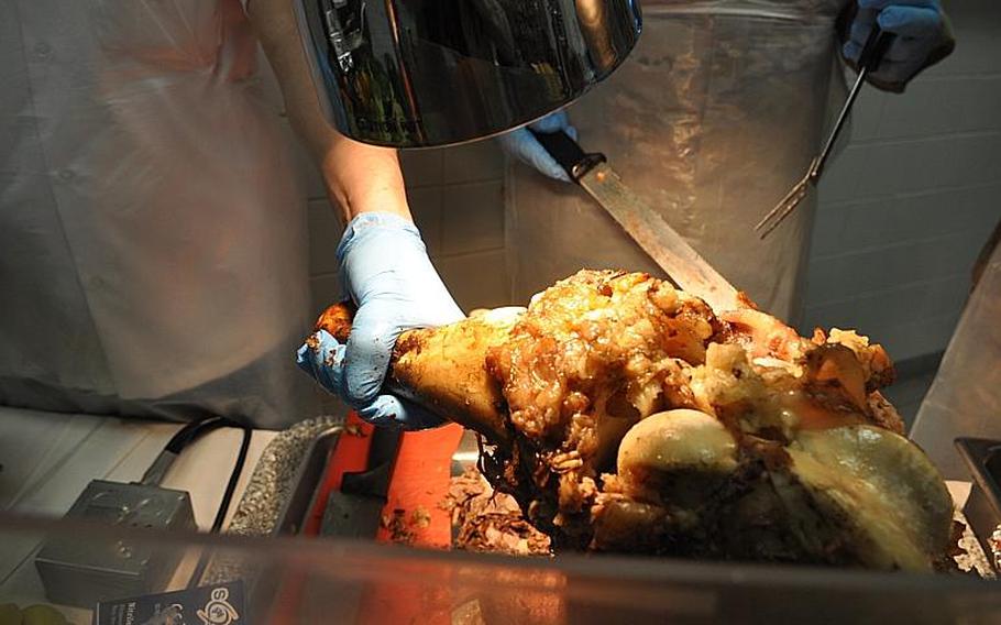 American forces across Afghanistan celebrated Thanksgiving on Thursday with all the traditional foodstuffs. Generals with U.S. Forces-Afghanistan carved turkey for servicemembers at the New Kabul Compound.