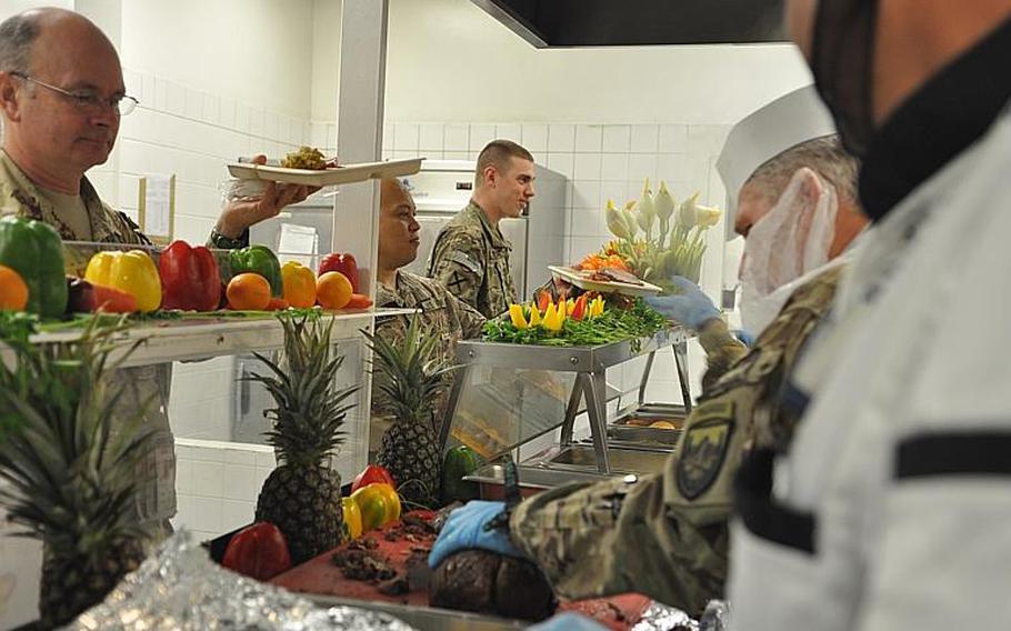 In Kabul, high-ranking brass and civilians alike jumped on the serving line -- even if it meant having to wear a beard-net, like Cliff Messman, senior advisor to U.S. Forces-Afghanistan's command.