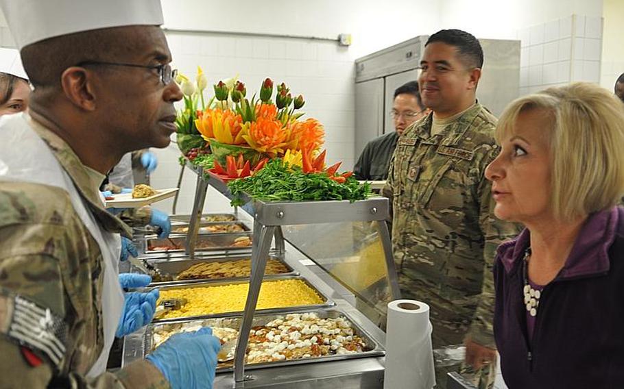 Brig. Gen. James Simpson of Combined Joint Support Contracting Command took a civilian's dinner order at the New Kabul Compound. Navy Capt. Doug Noble, the Defense Logistics Agency Support Team Commander for Afghanistan, said dining facilities can usually improvise and substitute their way through shortages, but holidays like Thanksgiving and Christmas with a traditional menu are "no-fail meals." For food and supply logistics workers, he added, "They're like our Superbowl."
