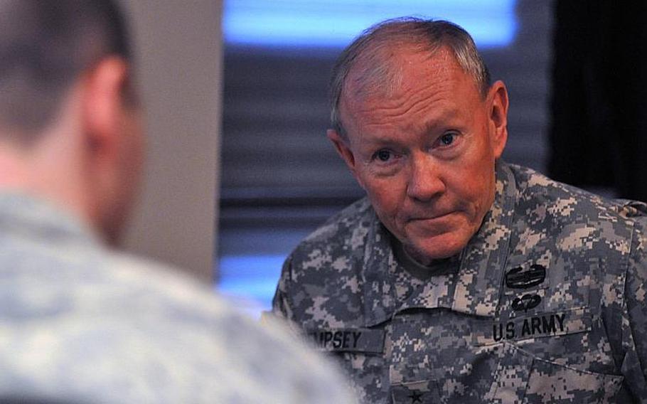 Chairman of the Joint Chiefs of Staff Gen. Martin Dempsey answers questions during an interview Wednesday, December 11, 2013, with Stars and Stripes before a town hall meeting with servicemembers at Aviano Air Base, Italy. Servicemembers asked questions concerning cuts to pay, retention and changes to fitness habits that will affect servicemembers in the near future.
