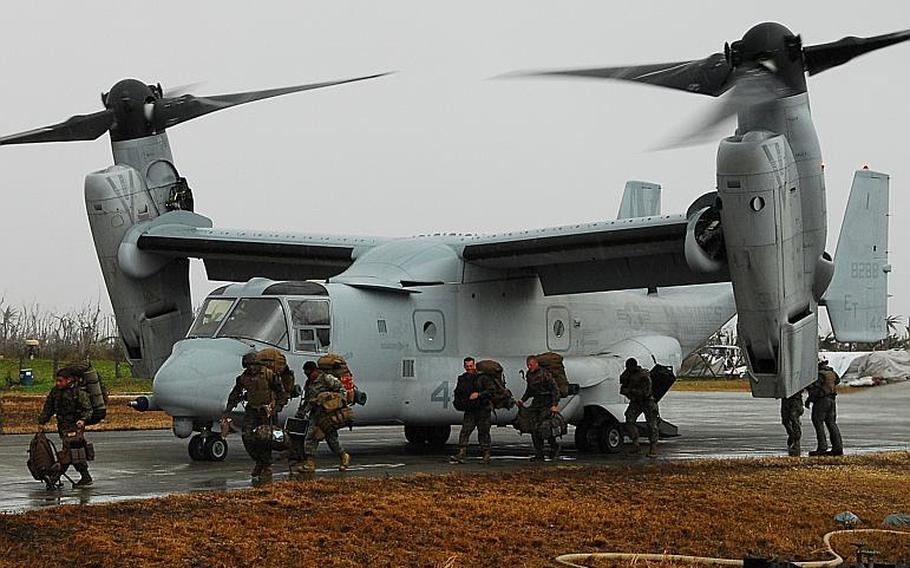 Marines get off a V-22 Osprey at the typhoon devastated town of Guiuan in the Philippines in November 2013.
