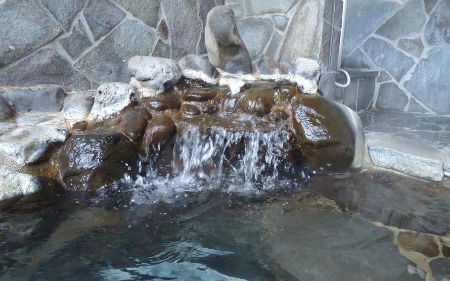 A miniature waterfall constantly feeds fresh hot spring water into the outdoor private onsen at Hirado Kaijyo Hotel, as shown in late December.