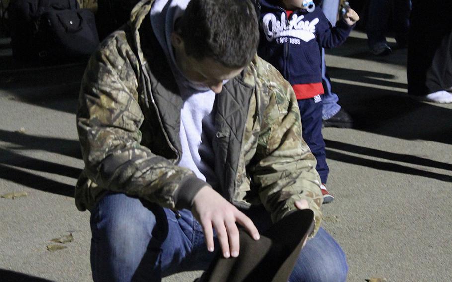 Daniel Hunt, 15, prays while waiting for his father, Cmdr. Thomas Hunt, to board a bus for a yearlong deployment to Afghanistan. The elder Hunt is a chaplain with I Marine Expeditionary Unit (Forward).