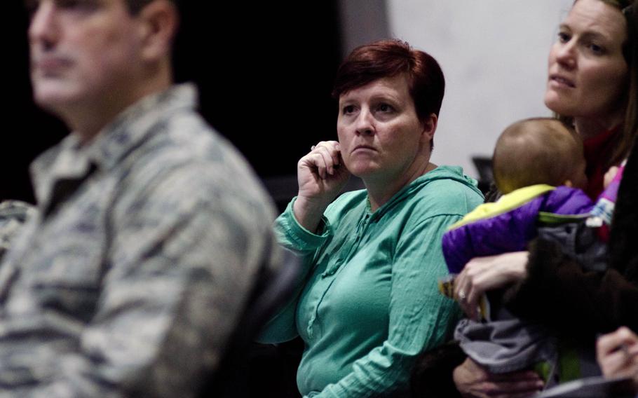 Airmen and their families gathered at the Airman Readiness Center at Yokota Air Base, Japan, on February 12, 2014, to get information about the U.S. Air Force's force reduction plan.
