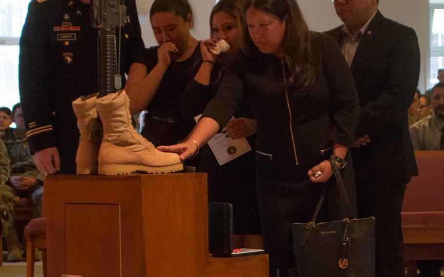 Memorial attendees say goodbye to Chief Warrant Officer 2 Edward Balli at the service on Feb. 12, 2014.
