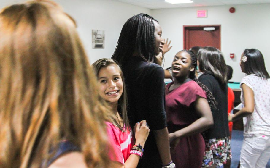 Teenagers on Naval Support Activity Bahrain see the new base Teen Center for the first time Aug. 22, 2013, minutes after the ribbon cutting ceremony officially opening the center.