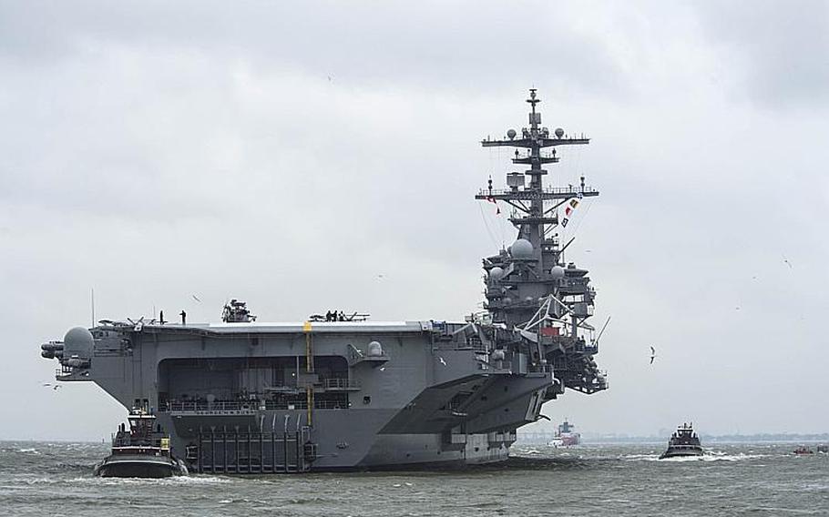 The aircraft carrier USS George H.W. Bush departs Naval Station Norfolk for its scheduled deployment.
