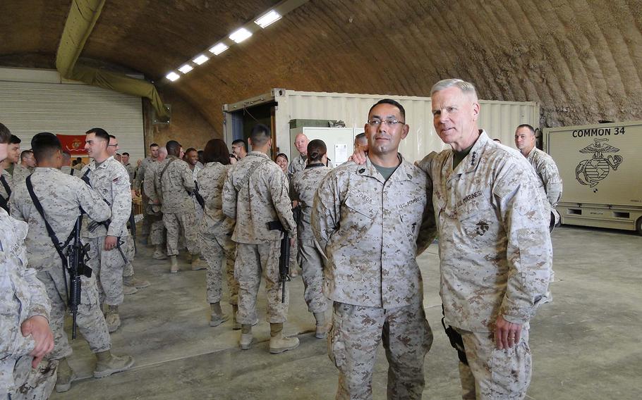 Commandant Gen. James Amos poses with Gunnery Sgt. Ricardo Ojeda, a reservist from Tucson, Ariz., after presenting an award to Ojeda's unit on Tuesday.