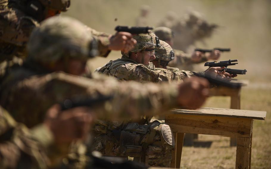 Soldiers with the 2nd Cavalry Regiment fire their M-9 pistols during an advanced weapons training, July 17, 2013, at the Grafenwoehr training area to prepare for their upcoming deployment to Afghanistan. To achieve a savings of about $2 billion per year in Europe, a Rand Corp. report says sweeping cuts and multiple base closures would be required, and includes the Army's Joint Multinational Training Center in Grafenwoehr as an option.