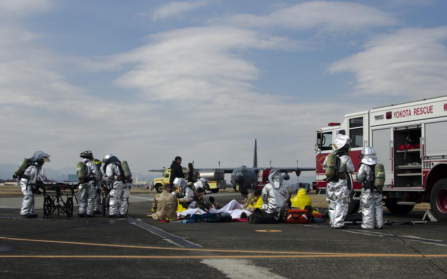 Yokota Air Base first responders have their capabilities tested at a simulated C-130 Hercules crash on base during the Samurai Readiness Inspection March 3, 2013.