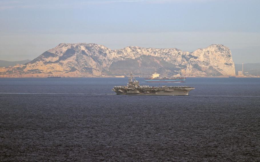 The aircraft carrier USS George H. W. Bush transits the Strait of Gibraltar on Feb. 27, 2014 . The carrier is conducting training operations in the Atlantic Ocean.