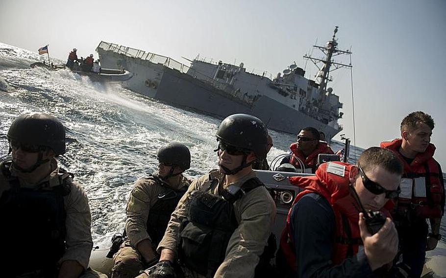 Sailors assigned to the guided-missile destroyer USS Bulkeley prepare to conduct a visit, board, search and seizure exercise in the Gulf of Oman. Bulkeley is deployed as part of the Harry S. Truman Carrier Strike Group in the U.S. 5th Fleet area of responsibility. 
