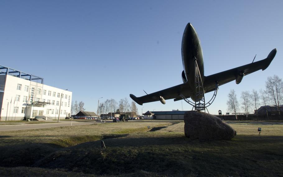An L-39 Albatros sits on display near a gate at Siauliai air base, Lithuania, on Tuesday, April 1, 2014. The base is host to NATO's Baltic Air Policing mission, and the U.S. currently provides F-15C Eagles and airmen for the mission.