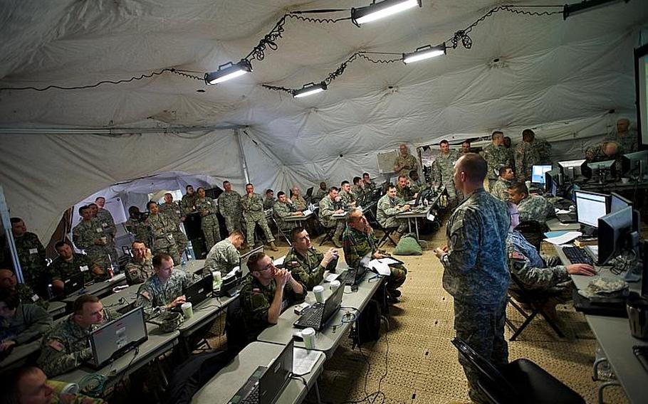 U.S. Army Europe's Contingency Command conducts a planning meeting March 26, 2014, during Saber Guardian 2014 at Novo Selo Training Area, Bulgaria.