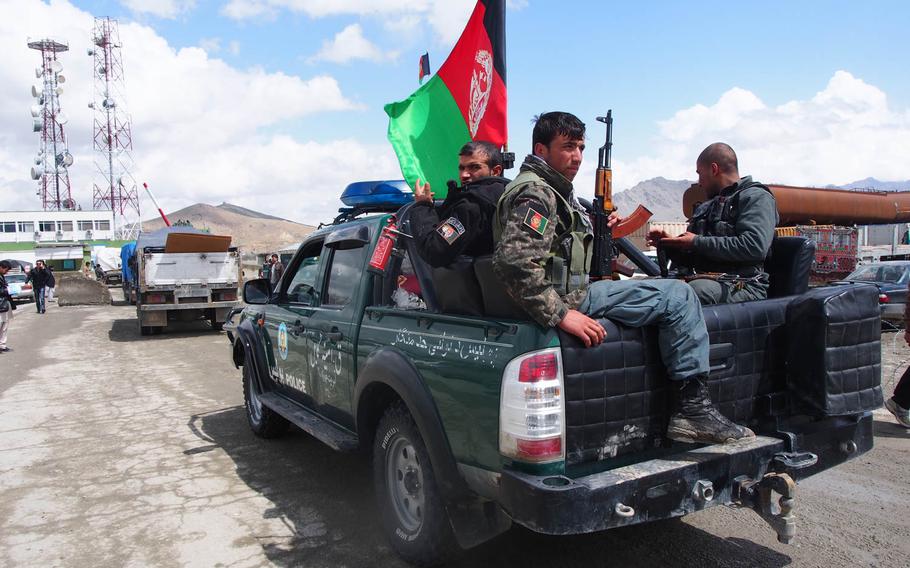 Afghan National Police officers accompany a convoy of trucks carrying ballots to Afghanistan's Independent Election Commission Sunday, April 6, 2014, a day after the country's presidential election. Experts say the Taliban was weakened by the vote, but the next president will have a monumental task in improving a government seen by many as corrupt and ineffective.