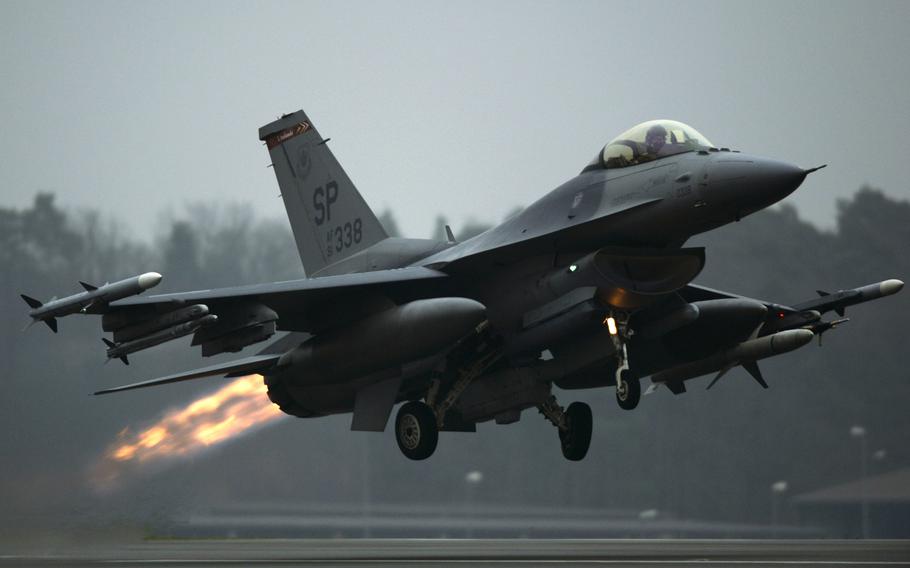 An F-16 Fighting Falcon fighter aircraft takes off from Spangdahlem Air Base, Germany, Dec. 4, 2013. The U.S. Air Force is sending 18 F-16s to Poland in June for joint training at Lask Air Base.