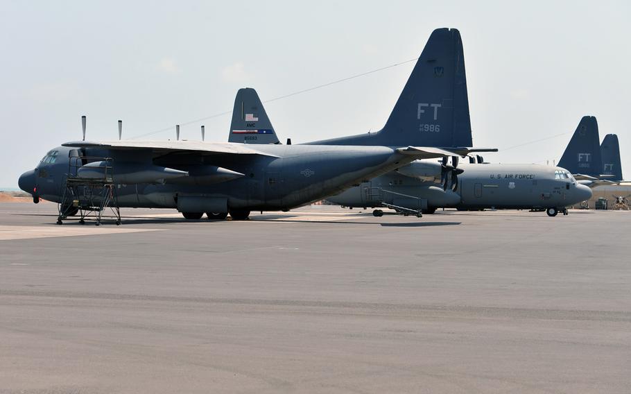 U. S. Air Force HC-130 and C-130 aircraft sit on the tarmac at Camp Lemonnier, Djibouti, Tuesday, April 1, 2014.