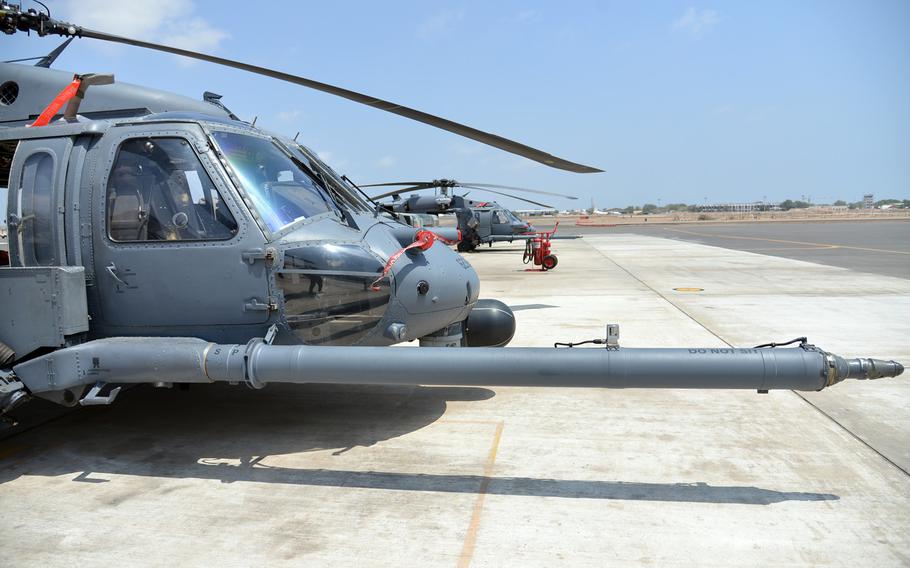 HH-60 Pave Hawk helicopters sit on the tarmac at Camp Lemonnier, Djibouti, Tuesday, April 1, 2014. The HH-60s are used mainly for personnel recovery missions