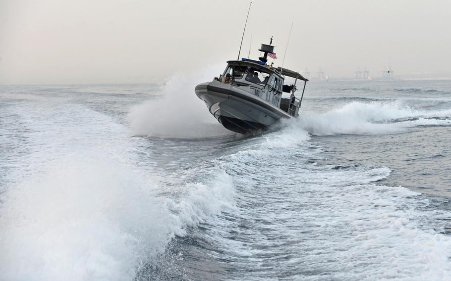 Following in the wake of another U.S. Navy Sea Ark, a boat of Coastal Riverine Squadron-1 Forward Wave 2 skips across the water while on patrol in Djibouti port. The vessels can reach speeds around 40 knots.