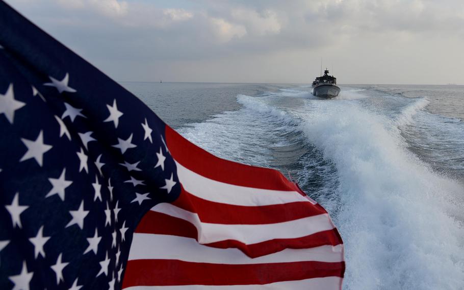 Following in the wake of another U.S. Navy Sea Ark, a boat of Coastal Riverine Squadron-1 Forward Wave 2 skips across the water while on patrol in Djibouti port. The Navy?s Coastal Riverine Squadrons, formed soon after the 2000 terrorist attack on the USS Cole in Yemen, provide security for Navy ships navigating through dangerous waters around the world.
