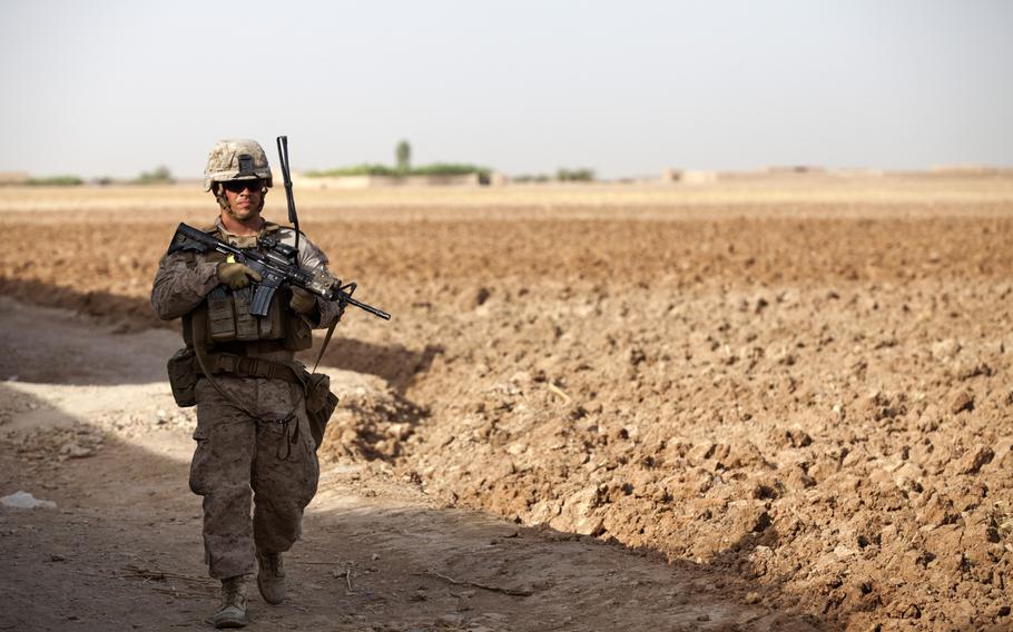U.S. Marine Corps Sgt. Joshua Farrell patrols during Operation Grizzly in Helmand province, Afghanistan, July 18, 2013. Grizzly was a counter-insurgency operation to deter enemy activity, establish a presence and gather human intelligence.