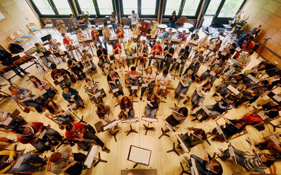 The honors band rehearses John Williams' ''Hymn for the Fallen'' at the Department of Defense Dependents Schools-Europe Honors Music Festival, Tuesday, April 15, 2014. Split between band and choir, nearly 160 students from DODDS-Europe high schools attended the annual festival.