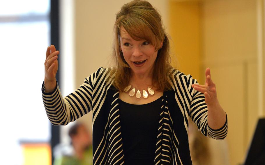 Guest conductor Nicole Lamartine directs the choir at the Department of Defense Dependents Schools-Europe Honors Music Festival, Tuesday, April 15, 2014. Nearly 160 students from DODDS-Europe high schools attended the annual festival.