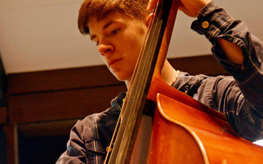 Kaiserslautern's Cameron Collums keeps the beat on bass as he rehearses with the band at the Department of Defense Dependents Schools-Europe Honors Music Festival, Tuesday, April 15, 2014. 
                Michael Abrams/Stars and Stripes
