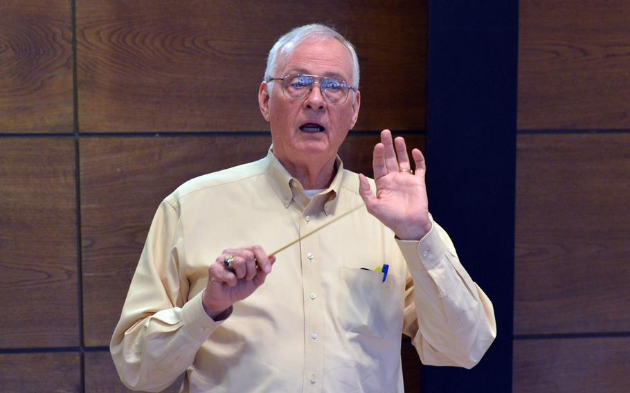 Guest conductor Cecil Wilder directs the band through a number during rehearsals at the Department of Defense Dependents Schools-Europe Honors Music Festival, Tuesday, April 15, 2014.