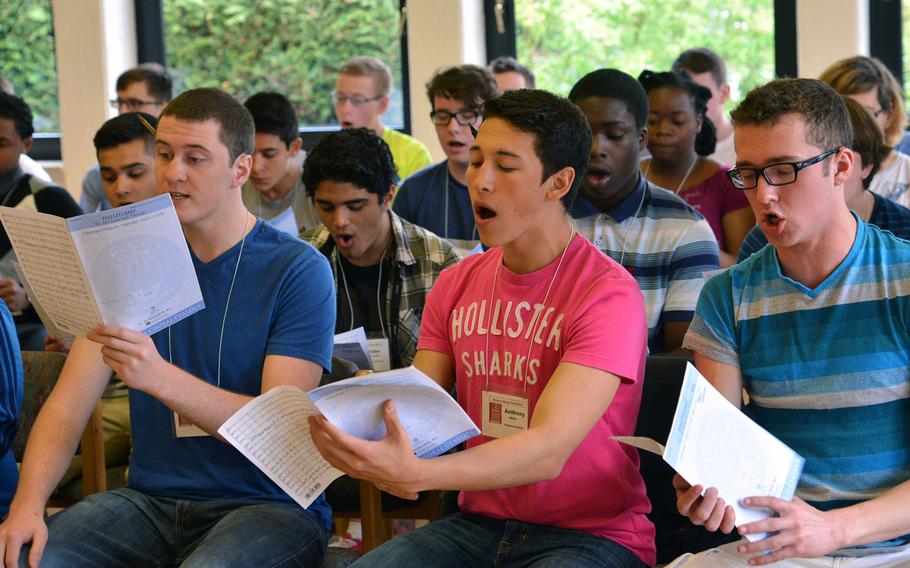 Members of the choir rehearse a tune at the Department of Defense Dependents Schools-Europe Honors Music Festival, Tuesday, April 15, 2014.
