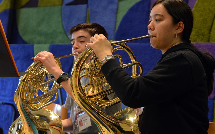 Brittaney Key, right, and Ramstein's Davis Fawcett play the French horns during a band rehearsal at the Department of Defense Dependents Schools-Europe Honors Music Festival, Tuesday, April 15, 2014.