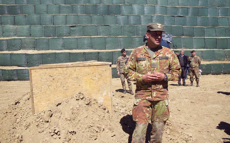 A World War II-era, 4,000-pound bomb was discovered by explosives experts surveying a field in October. It is the largest of some 133 bombs found in the area, and has been under constant police guard since then, covered with a wooden box and surrounded by monumental Hesco barriers.