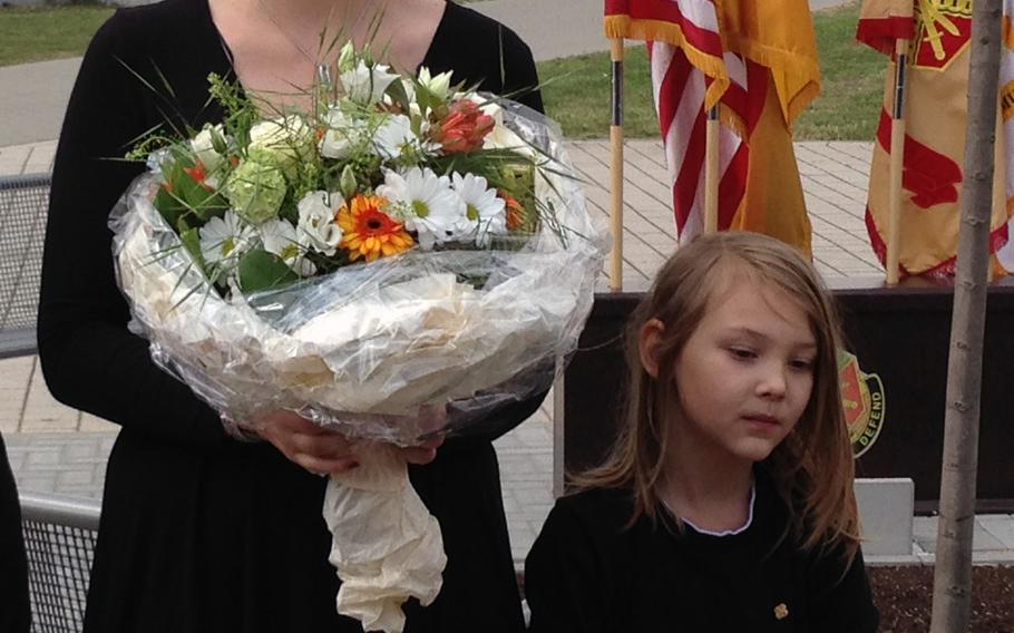 Bianca Long and her son, Lee Arick, surviving family members of Staff Sgt. Lee Arick Long III, are recognized by military community members at the Gold Star and Survivor Recognition Day ceremony on Clay Kaserne in Wiesbaden, Germany Tuesday, April 22, 2014.