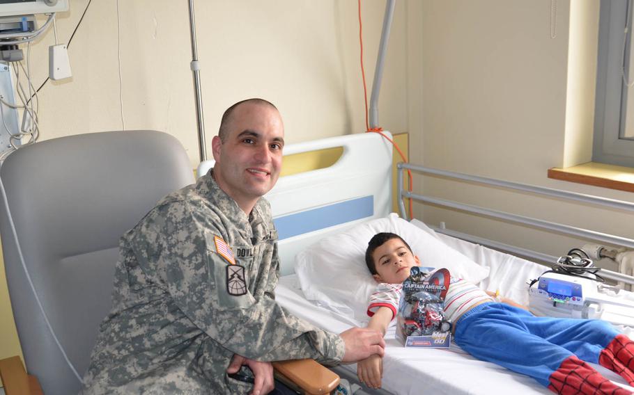 First Sgt. Jared D. Dowland, a soldier based at Supreme Headquarters Allied Powers Europe in Mons Belgium, rescued a five-year-old boy, named Mahmud, on Sunday, April 20, 2014. The boy had apparently fallen into a park lagoon and lost consciousness. Dowland provided CPR to resuscitate him and later visited him in the hospital.