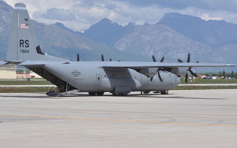 A C-130 cargo plane from Ramstein Air Base, loaded with servicemembers from the 173rd Infantry Brigade Combat Team based in Vicenza, Italy, awaits further instructions prior to departing Aviano Air Base, Italy for Poland on Wednesday, April 23, 2014.