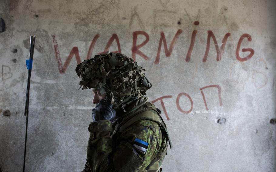 An Estonian soldier coordinates a fire mission with Estonian artillery during Summer Shield, on April 16, 2014, at Camp Adazi, Latvia.