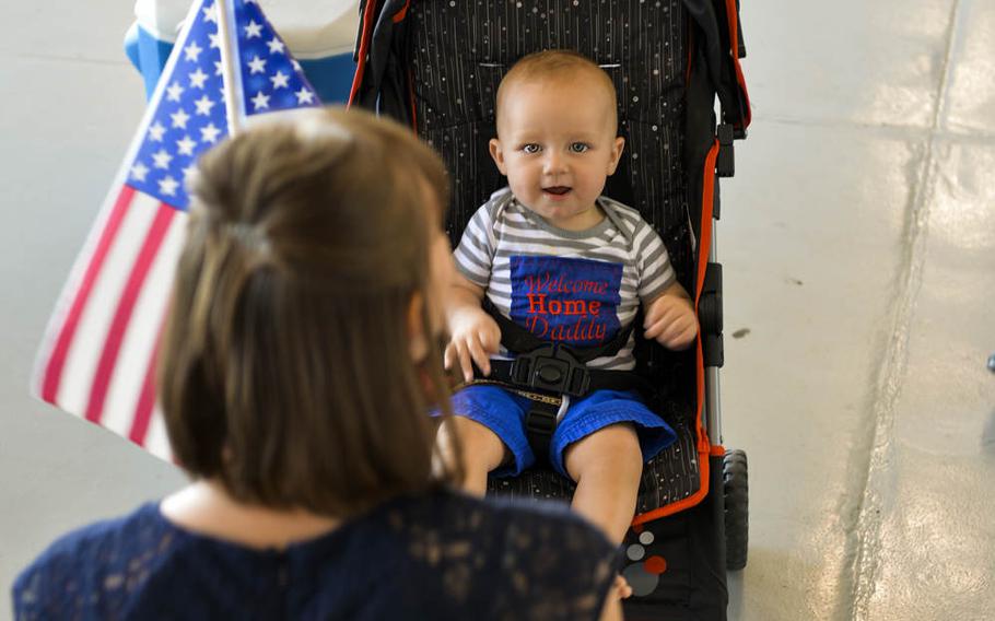 Danna and Max Shurn wait for Capt. Stephen Shurn, 15th Special Operations navigator, at Hurlburt Field, Florida, on Monday, April 21, 2014. Airmen from the 15th SOS and 9th Special Operations Squadron returned from a deployment. 