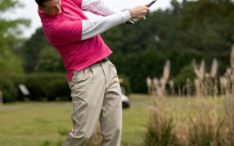 Airman 1st Class Brittain Crolley, 4th Fighter Wing Public Affairs photojournalist, tees off during the Sexual Assault Prevention and Response Program golf tournament, on Thursday, April 17, 2014, at Seymour Johnson Air Force Base, North Carolina. The tournament was one of six events held in conjunction with Sexual Assault Awareness Month. 