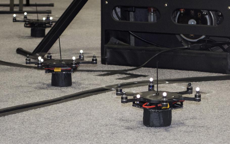 Drones manufactured by KMel Robotics rest on the ground before performing a musical number for the audience at the USA Science and Engineering Festival on April 25, 2014 in Washington, D.C.