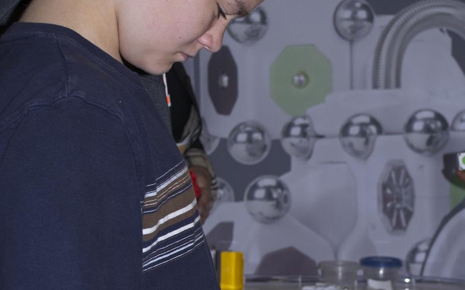 A young boy plays with robotics during the USA Science and Engineering Festival on April 25, 2014 in Washington, D.C.