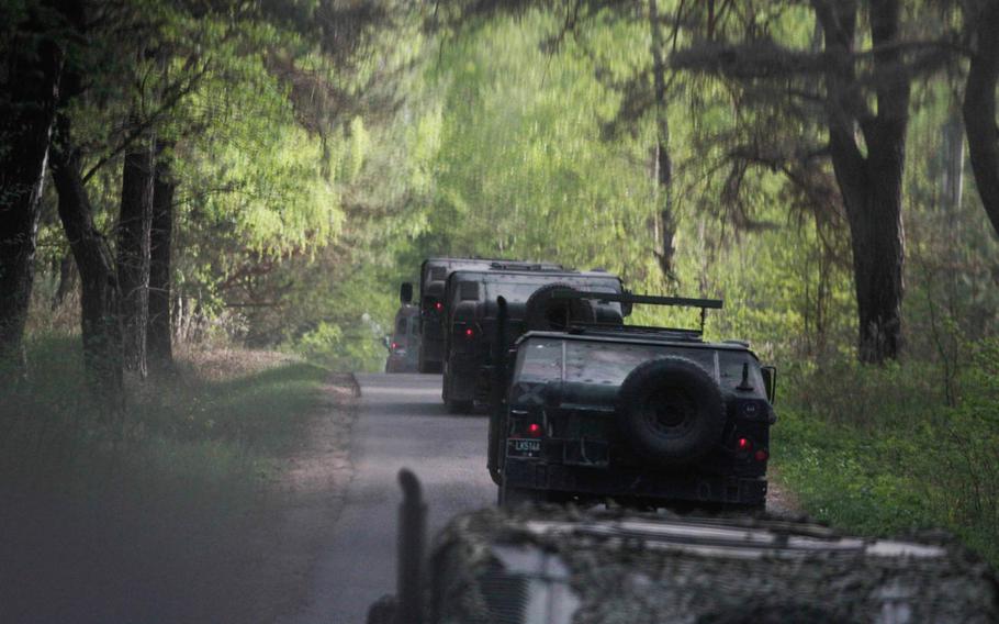 A convoy of Lithuanian Humvees drives through the country's Rukla Training Area Tuesday, April 29, 2014. A company of American 173rd Infantry Brigade Combat Team soldiers from Vicenza, Italy, arrived here Saturday to conduct training with the Lithuanians, part of a deployment of 600 173rd paratroops meant to reassure NATO allies concerned about Russian aggression.