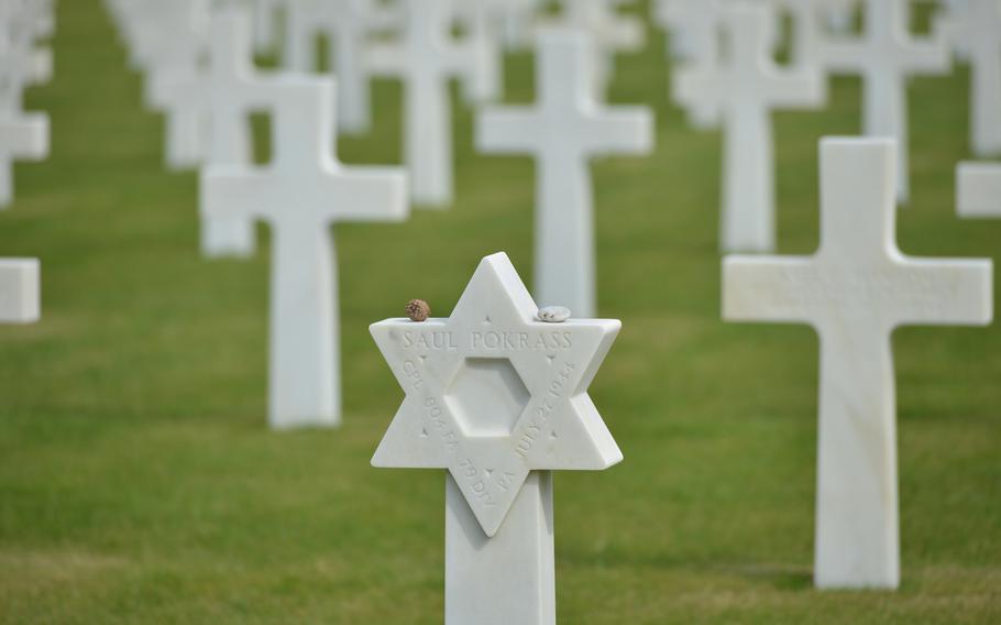 A Star of David marks the grave of a Jewish soldier at Normandy American Cemetery at Colleville-sur-Mer, France. Among the 9,387 graves at the cemetery, 149 of the marble headstones are topped by the Star of David.