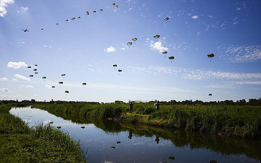 More than 600 international paratroops, including over 400 Americans, jump in Cauquigny, France, to commemorate the 70th anniversary of D-Day, June 8, 2014.
                