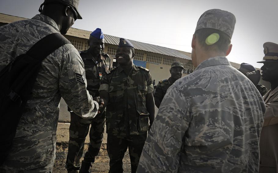 Staff Sgt. Mo Gadiaga, U.S. Air Forces in Europe and Air Forces Africa cultural adviser, greets the team leads from each attending country during African Partnership Flight in Dakar, Senegal on Monday, June 16, 2014.