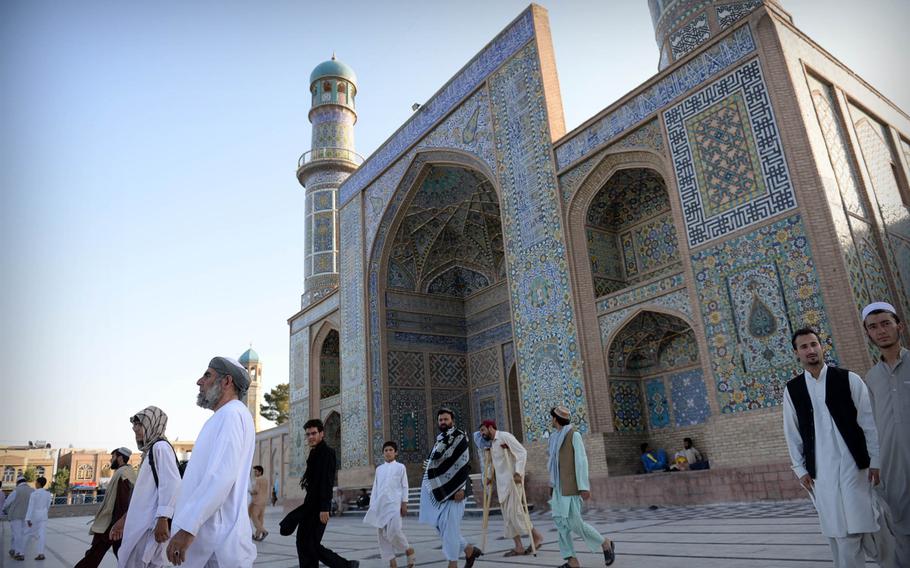 Men leave the Jama Masjid, a mosque in downtown Herat, after Ramadan prayers. Residents of this city in western Afghanistan say they favor keeping international troops in their country as a bulwark against both internal insurgents and neighboring countries.