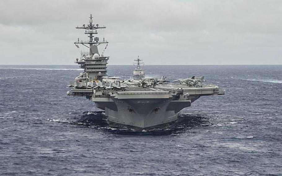The Nimitz-class aircraft carrier USS Carl Vinson underway in formation in the Pacific Ocean, Sept. 23, 2014.