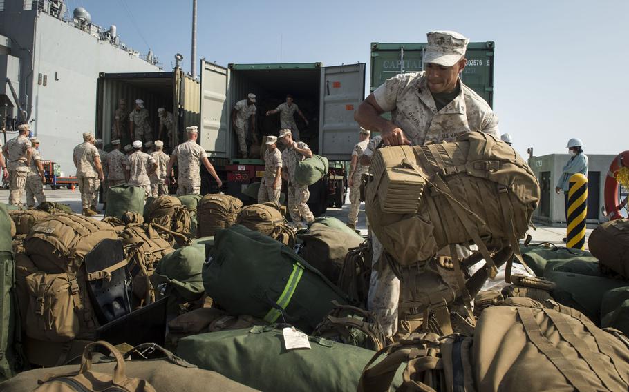 Marines assigned to the 31st Marine Expeditionary Unit on Okinawa prepare to embark the USS Germantown in September 2014. Under a new agreement, Japanese officials will have access to U.S. military bases in Japan following oil spills and environmental accidents.