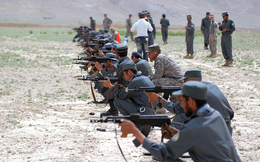 U.S. forces help train new Kabul police recruits to fire the AK-47 assault rifle on the grounds of the Kabul Military Training Center in this 2009 photo. A Special Inspector General for Afghanistan Reconstruction report found that the Defense Department has not accurately tracked 747,000 weapons purchased for Afghan National Security Forces.