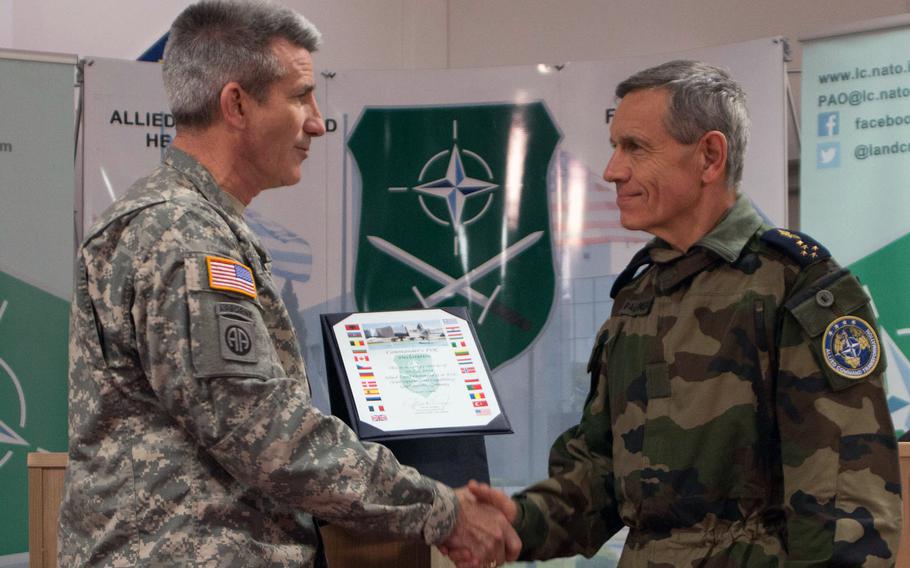 Lt. Gen. John W. Nicholson, left, commander of the NATO Allied Land Command, reports to NATO's Supreme Allied Commander Transformation, French Gen. Jean-Paul Paloméros, that LANDCOM is fully operational, at Grafenwoehr, Germany, on Dec. 10, 2014.